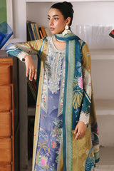 Woman wearing a colorful traditional outfit with a patterned dupatta.