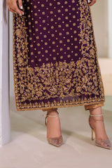 Close-up of hand-embroidered golden floral motifs on Plum Royale dress by Bazzaz