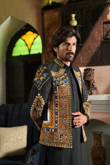 Handworked collar and shoulder accents on Zemarai groom outfit