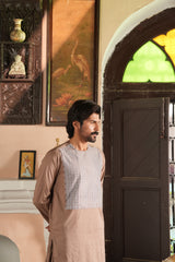 Side profile of Pashto groom dress from Rakhan Collection