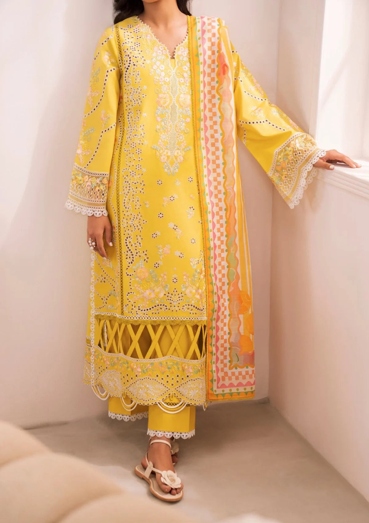 Front view of Zavi ZV-108 Serio yellow embroidered lawn suit
