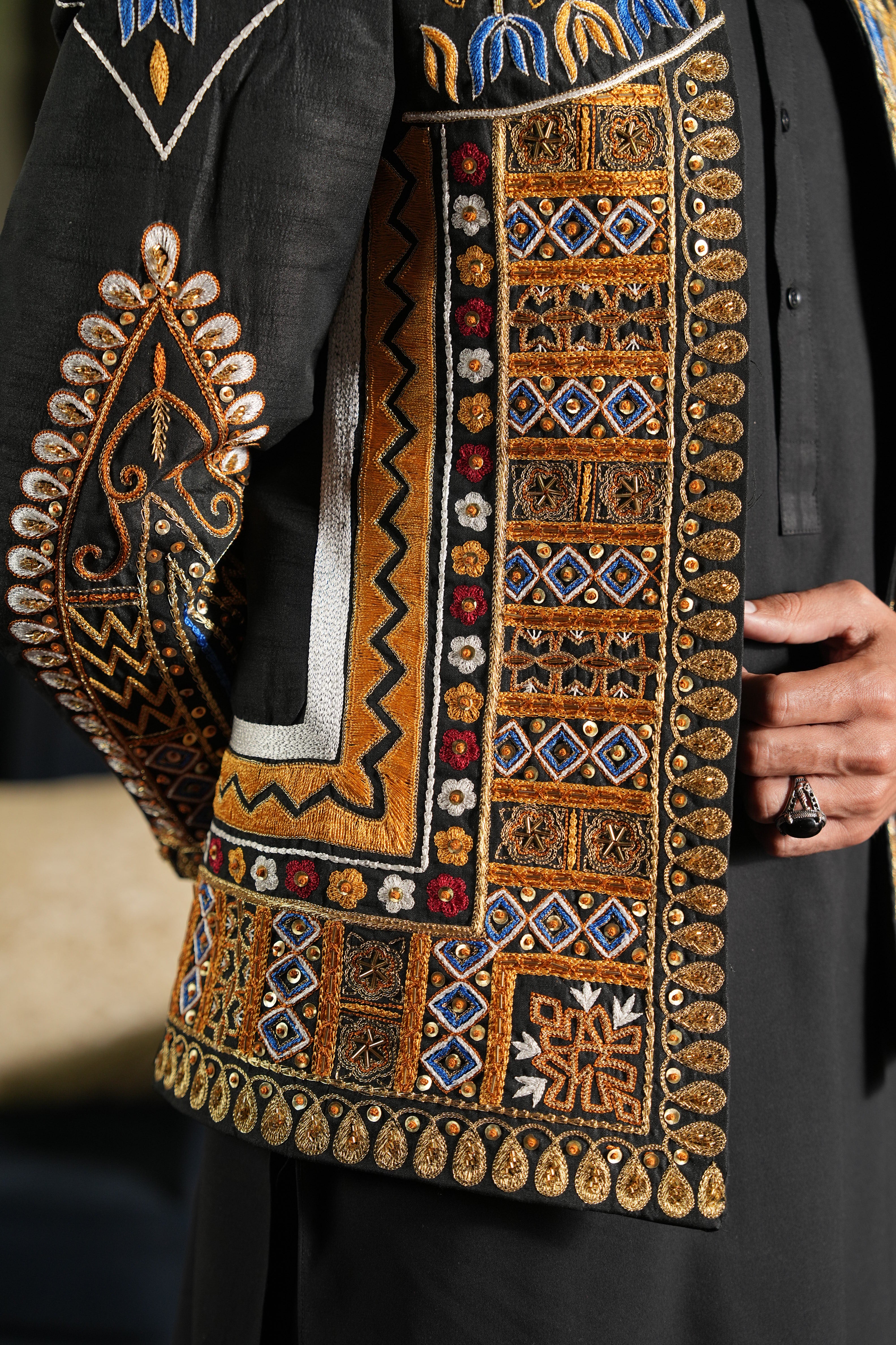 Closeup of Afghani-inspired embroidery on Zemarai groom dress