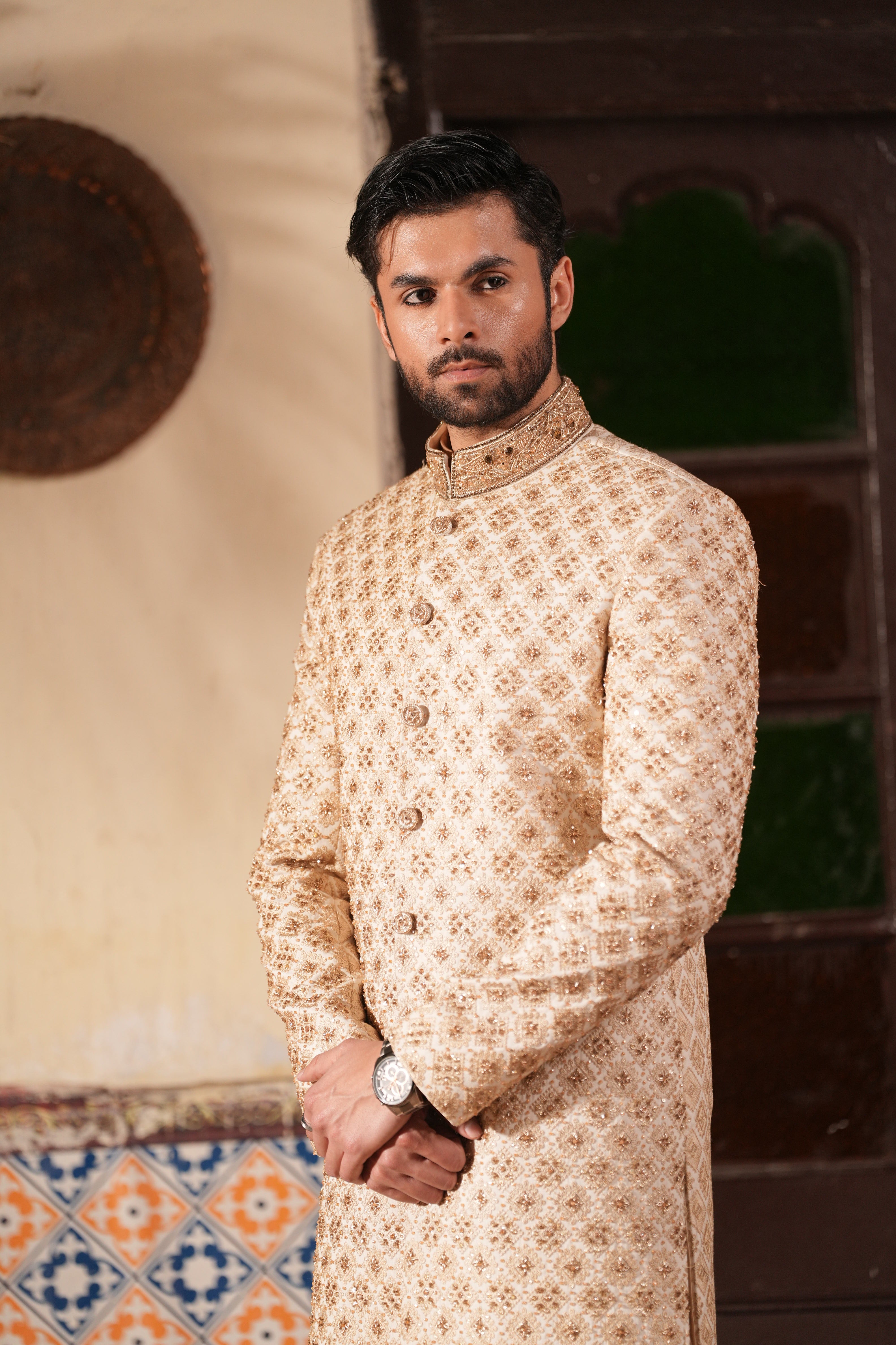 Display view of Mehr Raaj sherwani under wedding lighting

