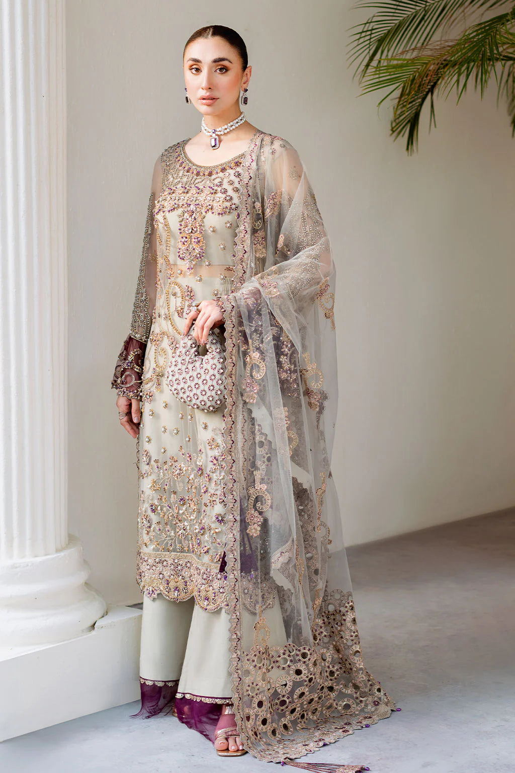 Embroidered and embellished net back with sequins and tassel detail