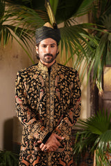 Intricate maroon and golden threadwork on Zar-e-Siyah couture sherwani