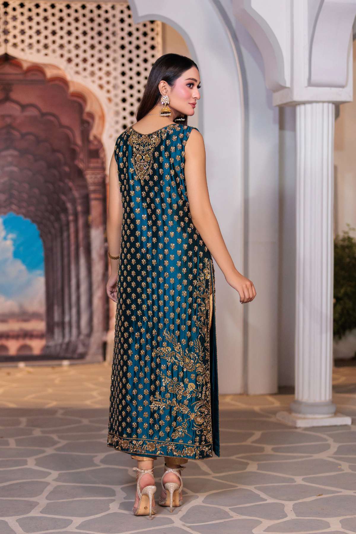 Side profile showing intricate golden embroidery on Zehra Luxe festive dress
